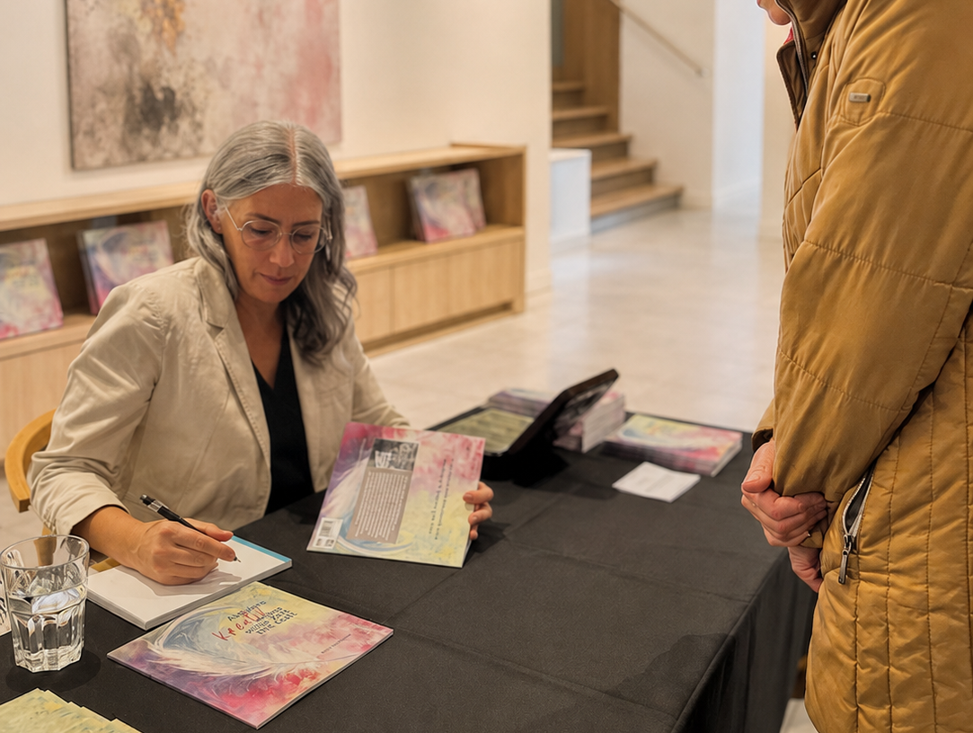 Ruth Truttmann signing books at an exhibition